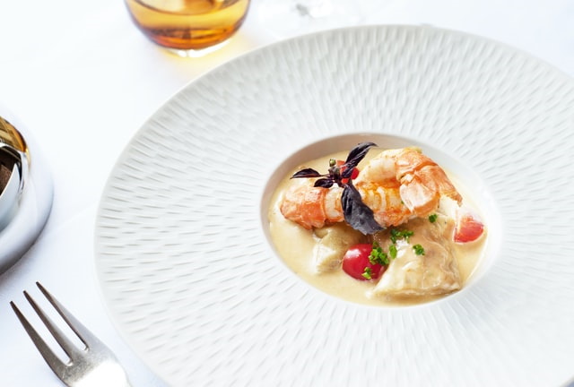 Elegant poached lobster in white wine sauce